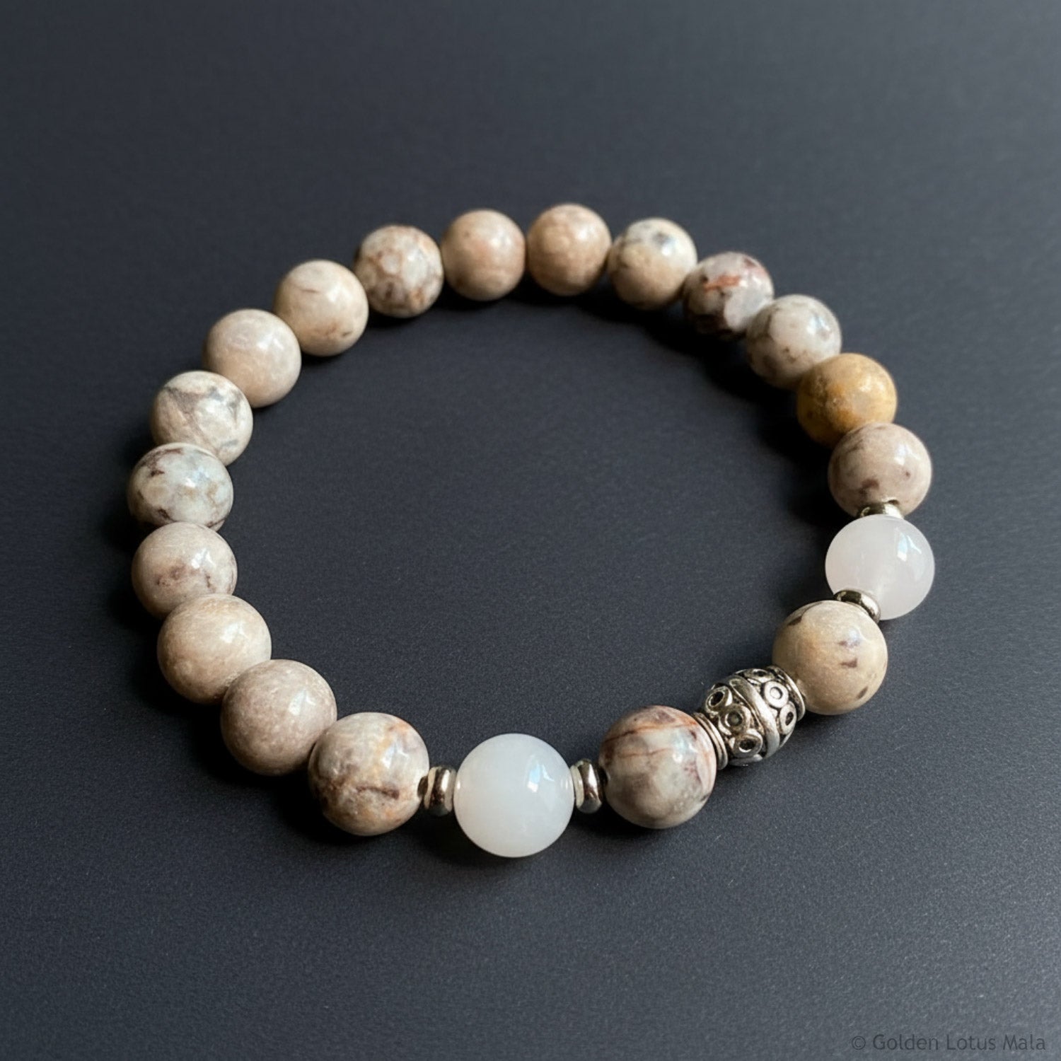 Beaded bracelet with natural stone beads on a dark background