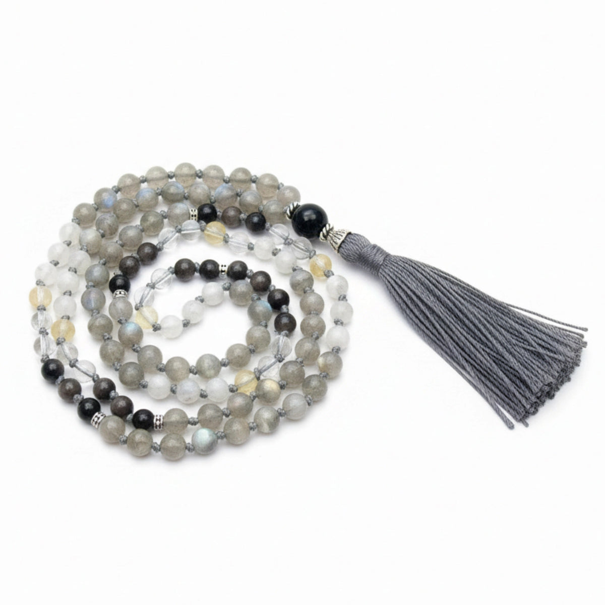 Mala necklace with a gray tassel on a white background