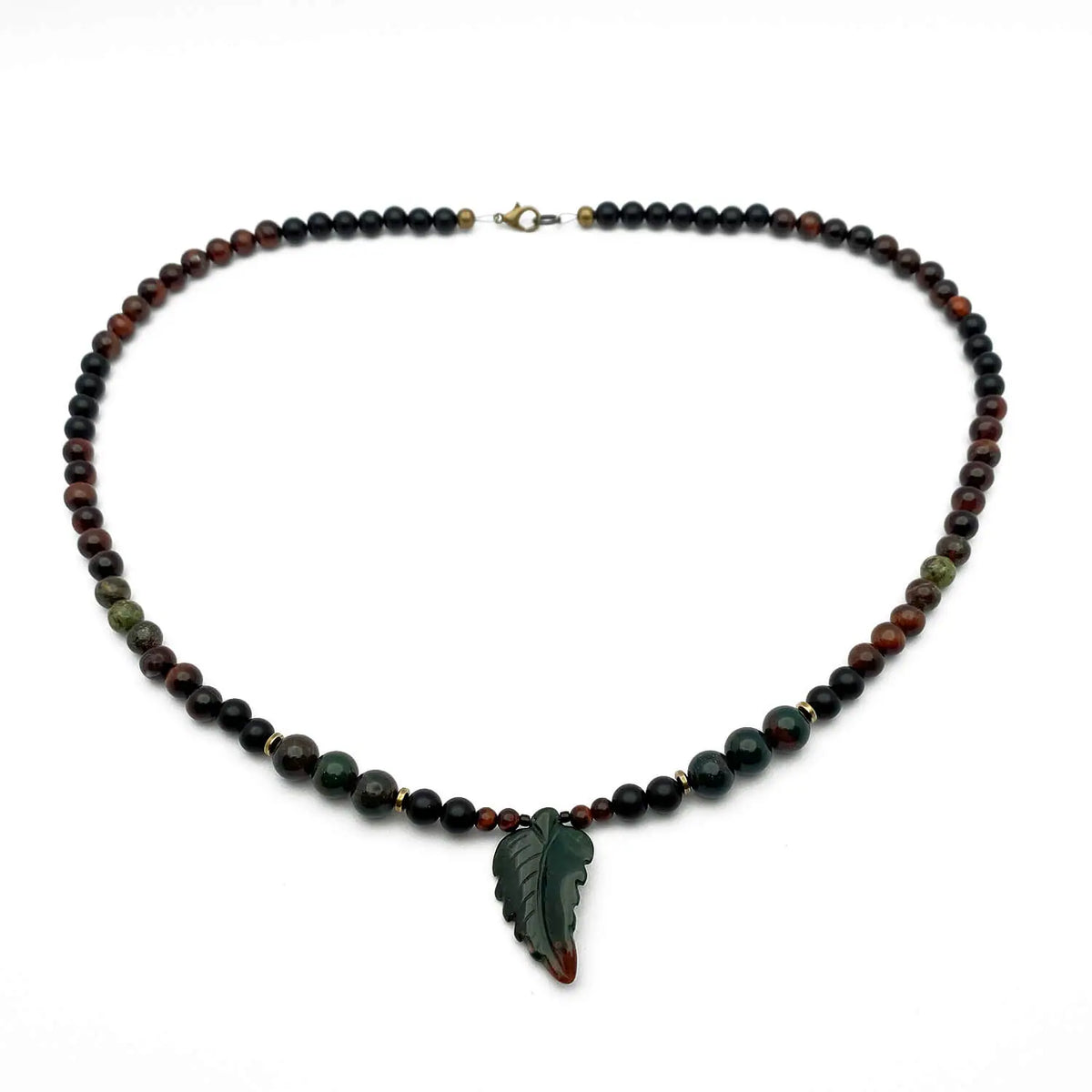 A beaded necklace made of gemstones with a Jasper leaf pendant.