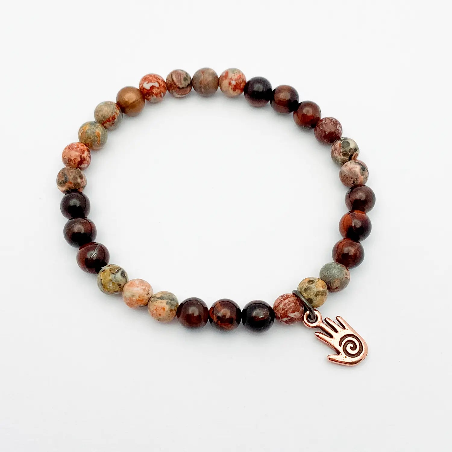 Beaded bracelet with a reiki hand charm on a white background