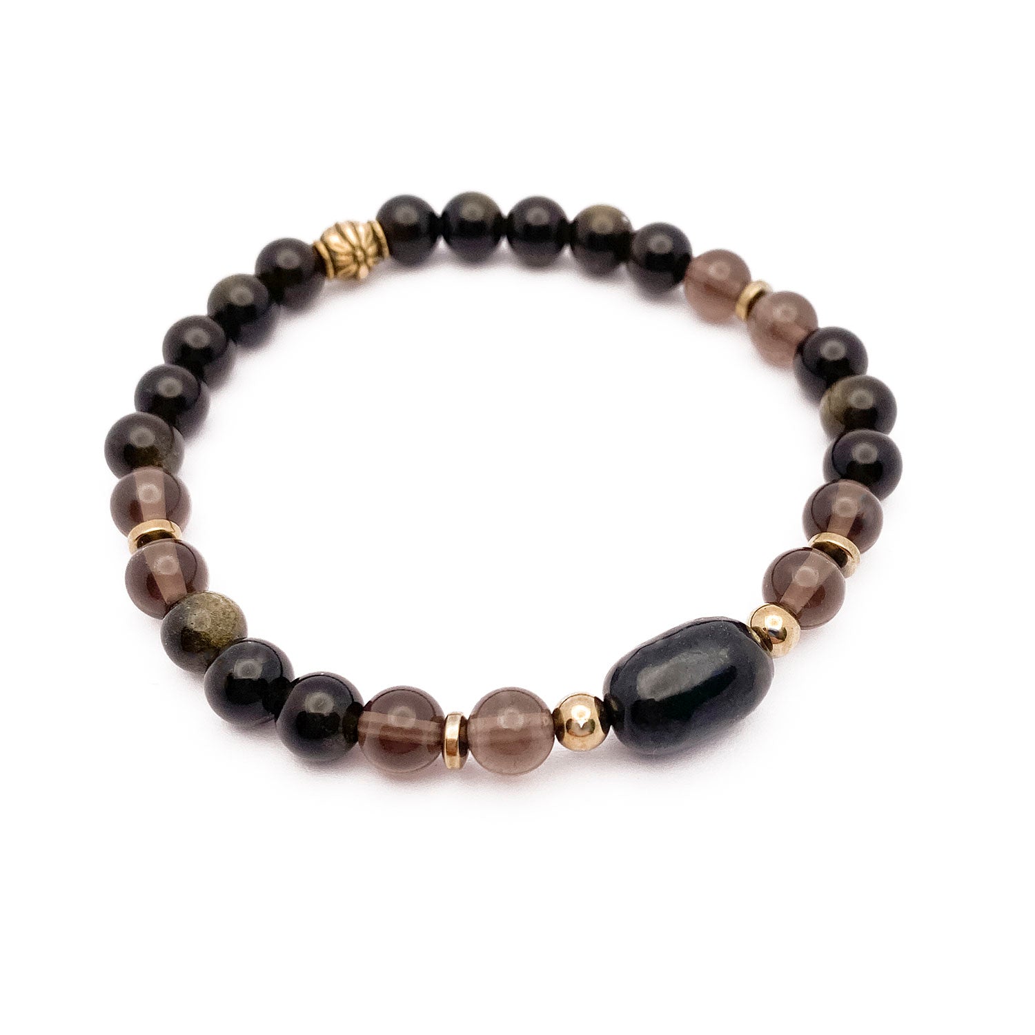 Beaded bracelet with black and gold beads on a white background