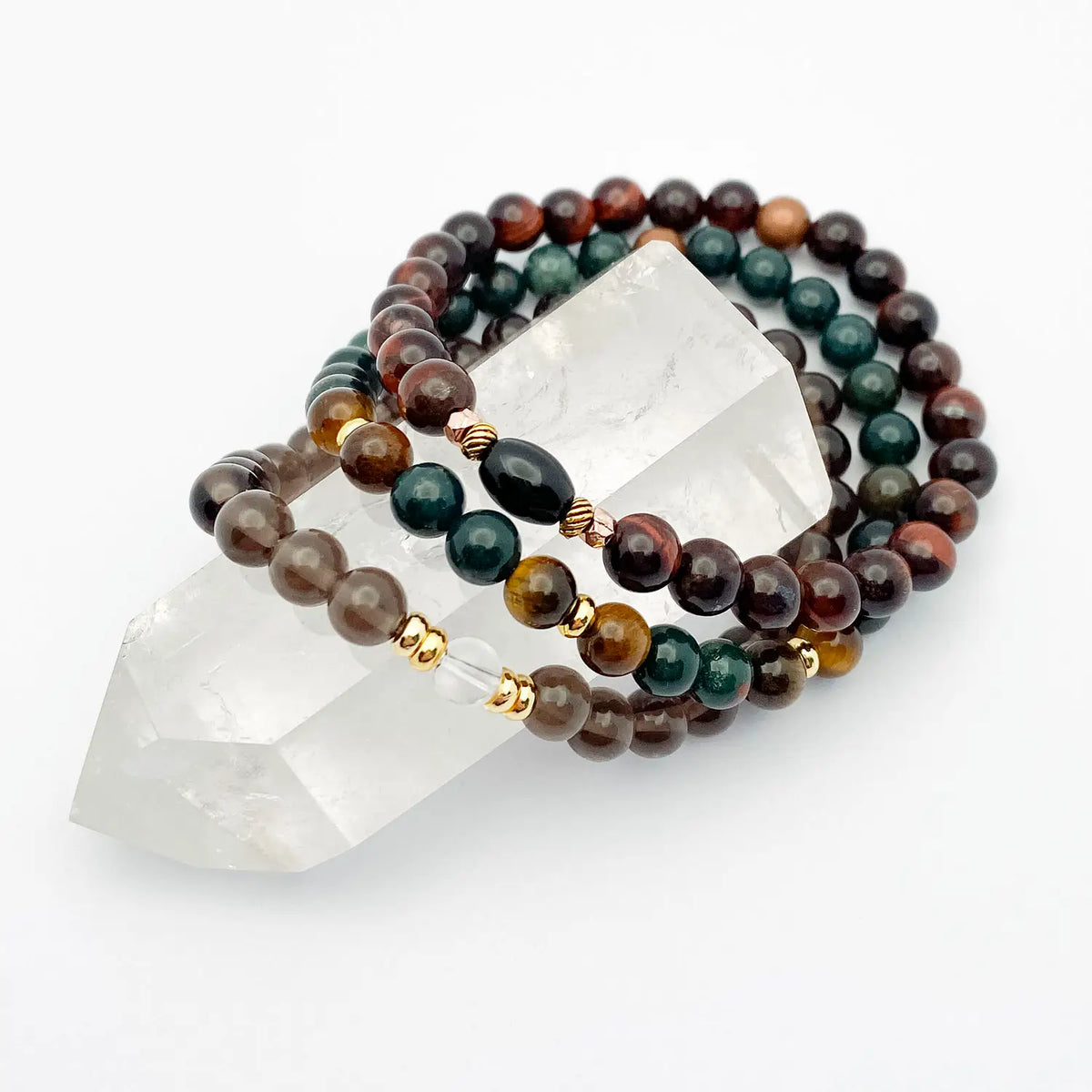Beaded bracelets with a crystal on a white background